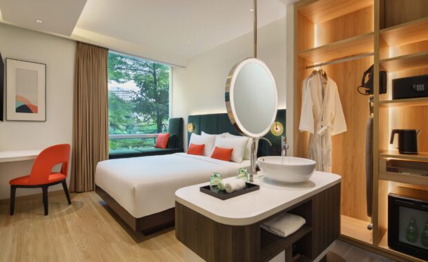 Superior Queen Bedroom at Park Regis by Prince Singapore, Featuring a Comfortable Queen-Size Bed Ideal for 1 to 2 Guests